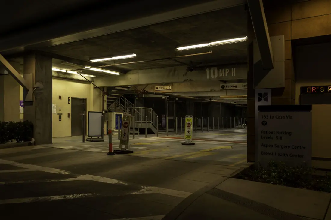 Before: Parking garage drive aisle and elevator lobby